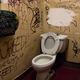 Illustration for article titled Painted-Over Spot On Public Bathroom Wall Must Conceal Some Really Fucked-Up Graffitiem/em